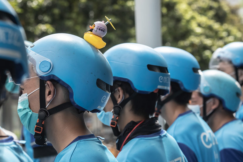 Delivery drivers during a morning staff meeting in Guangzhou, Guangdong province, June 2020. People Visual