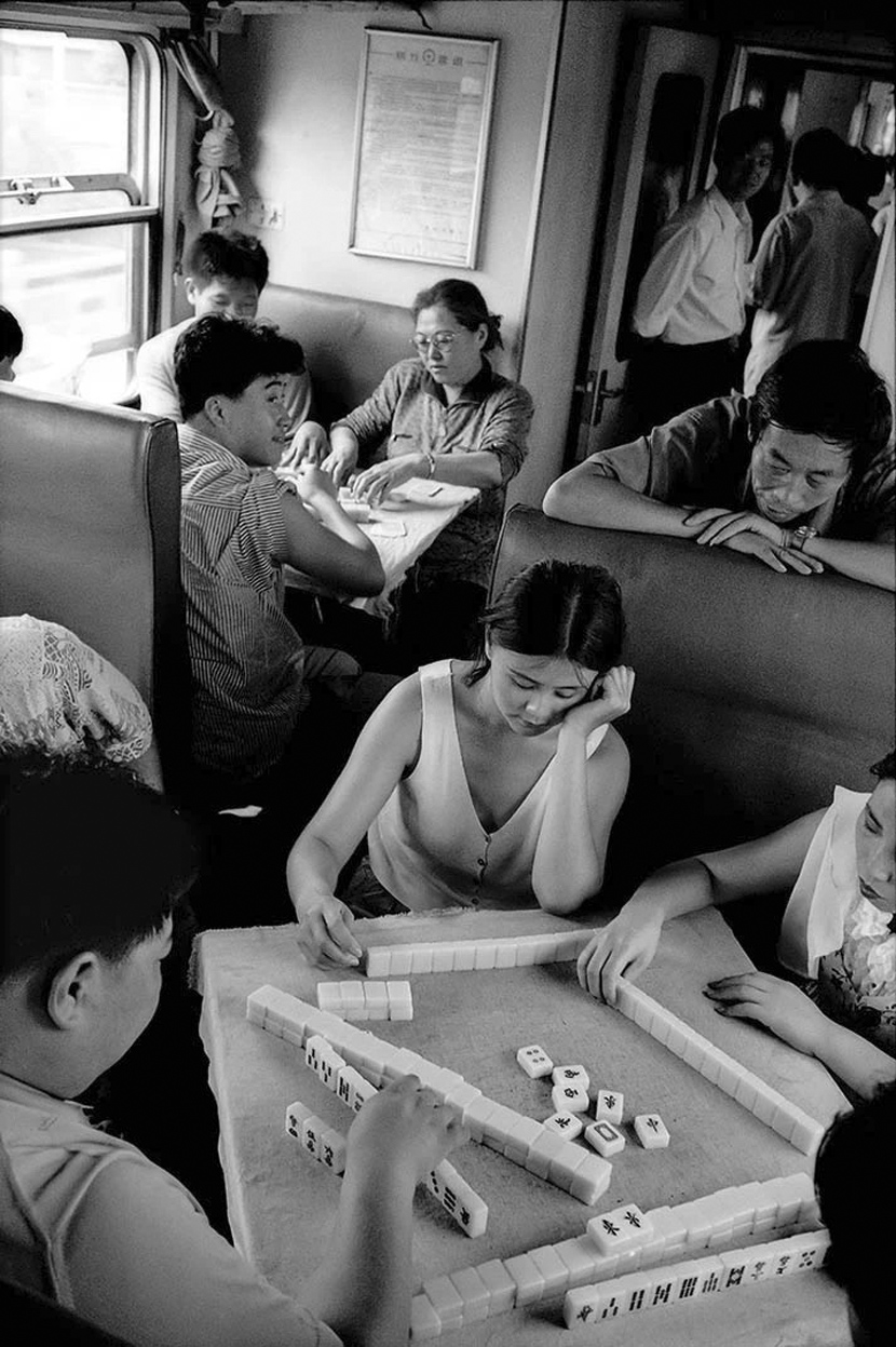 Passengers on a train from Beijing to Shenyang in northern China, 1994. Courtesy of Chinese Photography