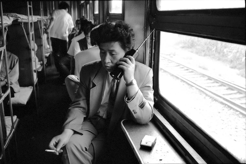 A passenger on a train from Shenyang to Dalian in northern China, 1994. Courtesy of Chinese Photography