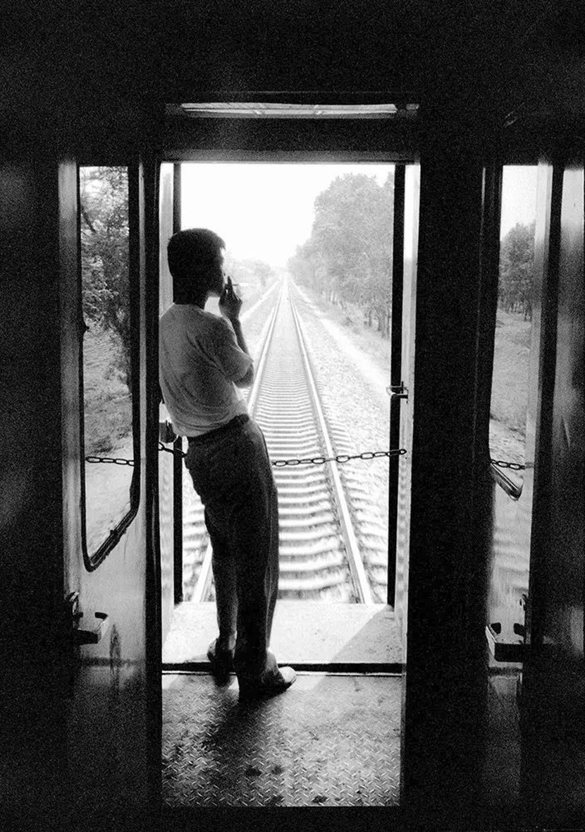 A passenger on a train from Harbin to Jinan, 1997. Courtesy of Chinese Photography