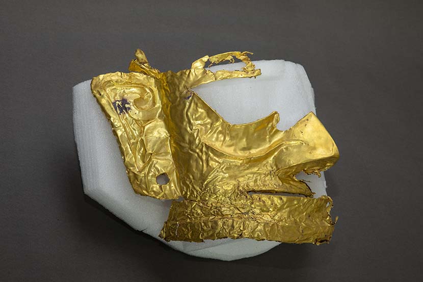 A fragment of a gold mask recently found at the Sanxingdui Ruins, Guanghan, Sichuan province, March 17, 2021. Xinhua