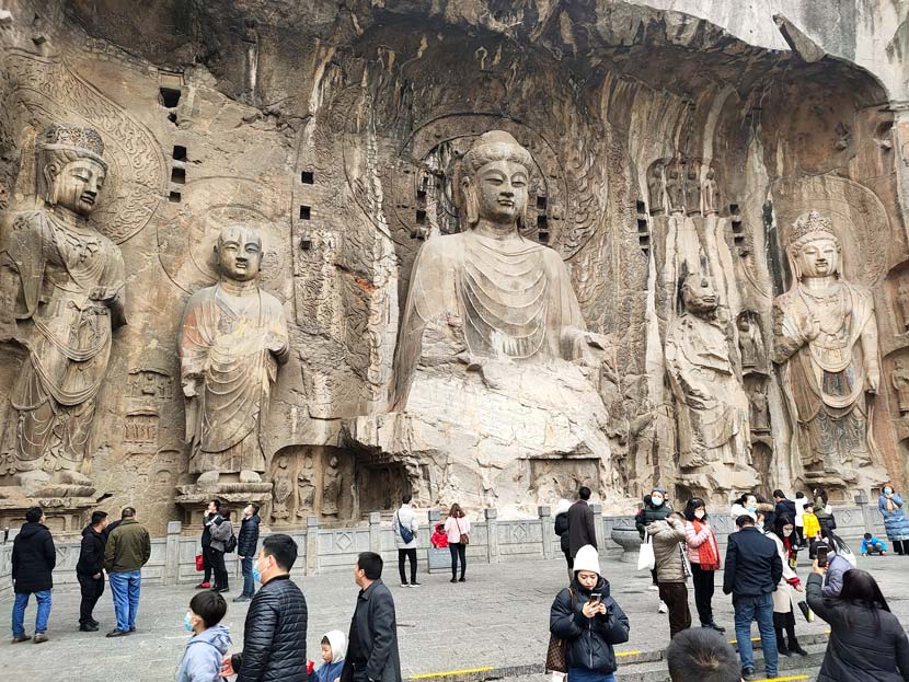 Tourists visit the Longmen Grottoes in Luoyang, Henan province, Dec. 6, 2020. People Visual