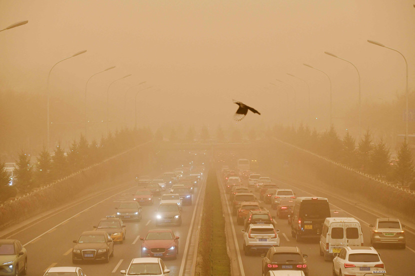 Motorists commute during a sandstorm in Beijing, March 15, 2021.Greg Baker/AFP/People Visual