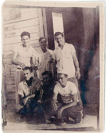 Huang Baoshi (center, back) and some locals, including his adopted son in Cuba, 1958. Courtesy of Huang Zhuocai