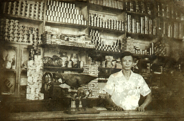 Huang Baoshi in his general store, in 1936/1937. Courtesy of Huang Zhuocai