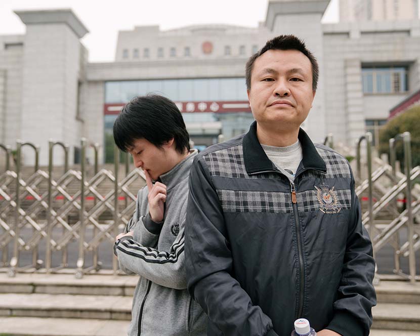 LGBT rights activist Sun Wenlin (left) and his partner Hu Mingliang outside the Changsha Furong District People’s Court in Changsha, Hunan province, March 16, 2021. Wu Huiyuan/Sixth Tone