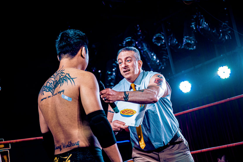 Steve the ESL Teacher tests another fighter’s English during an episode of Middle Kingdom Wrestling’s show “Blast-off!”, recorded in Harbin, Heilongjiang province, 2020. Courtesy of MKW