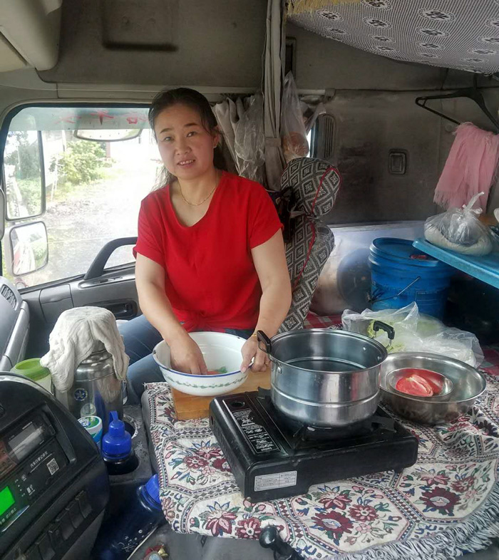 Miao Huiling cooks a meal in the truck. Courtesy of Transfar Harbour