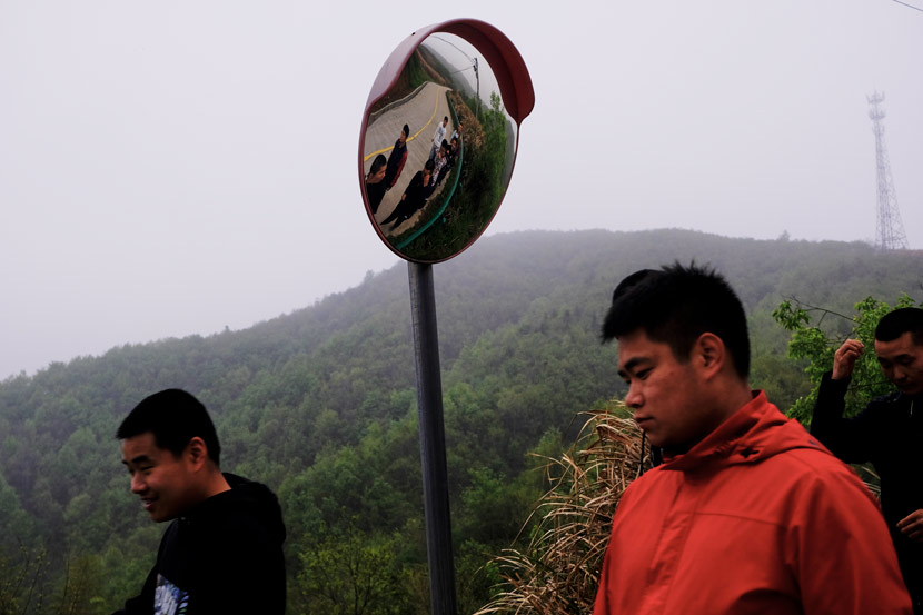 A carer (right) accompanies a resident of Home of the Stars (left) on a walk, in Jinzhai County, Anhui province, March 2021. The residents are taken for 10-kilometer walks every day. Wu Huiyuan/Sixth Tone