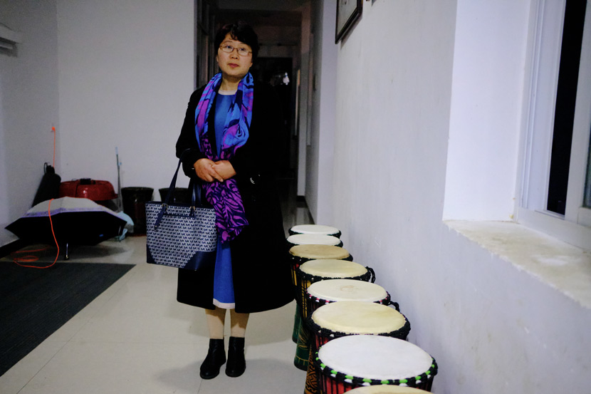 Yu Hua poses for a photo in Jinzhai County, Anhui province, March 2021. She commutes between the school and her home every day to supervise activities at Home of the Stars. Wu Huiyuan/Sixth Tone