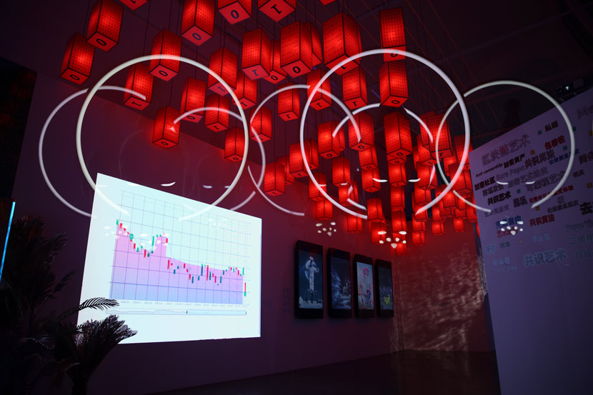 Chinese lanterns covered with binary code hang inside the “Virtual Niche” exhibition, at UCCA, Beijing, March 2021. Courtesy of BCA