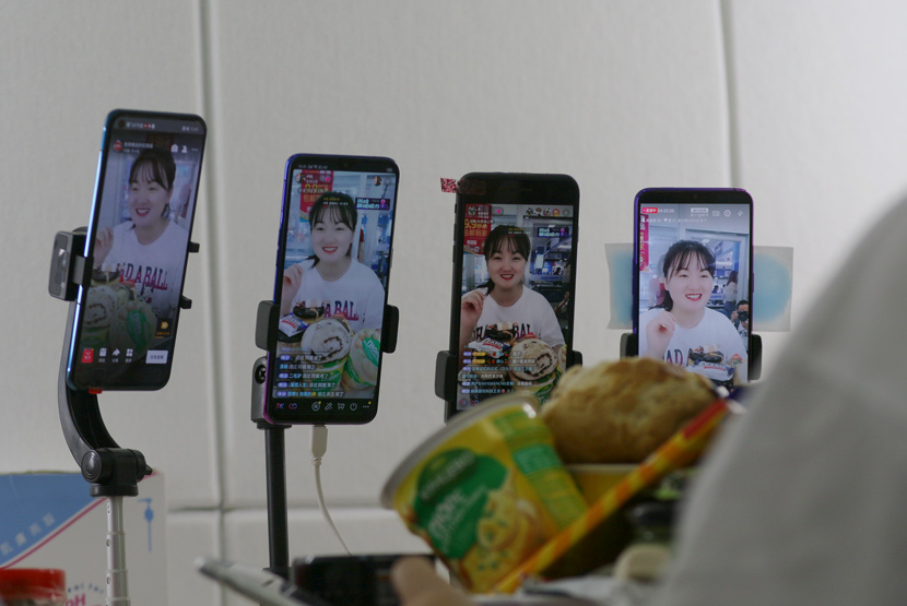 A livestreamer promotes local delicacies from Heihe, Heilongjiang province, July 2020. People Visual