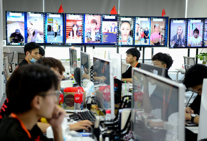 Staff work at an MCN agency in Fujian province, 2020. The monitors show livestream shows taking currently underway. Wang Dongming/CNS/People Visual