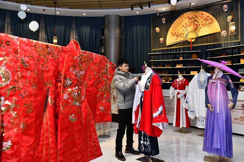 A man works at his “hanfu” studio in Cao County, Shandong province, Dec. 12, 2020. Xinhua