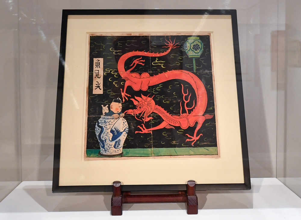 The original cover for “The Blue Lotus” on display at Artcurial Auction House, in Paris, France, Jan. 12, 2021. Hergé created the artwork for the initial cover in 1936. Lionel Urman/ABACAPRESS.COM via People Visual