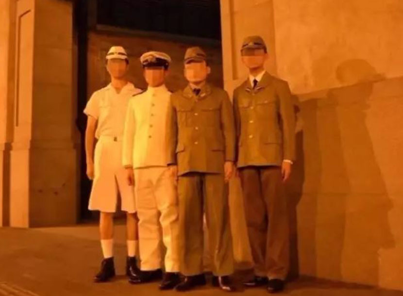 Four men dressed in WWII-era Japanese military uniforms pose for a photo in front of the Sihang Warehouse War Memorial Hall in Shanghai, Aug. 7, 2017. From Weibo user ‘ShanghaiZhiying_5ZN’