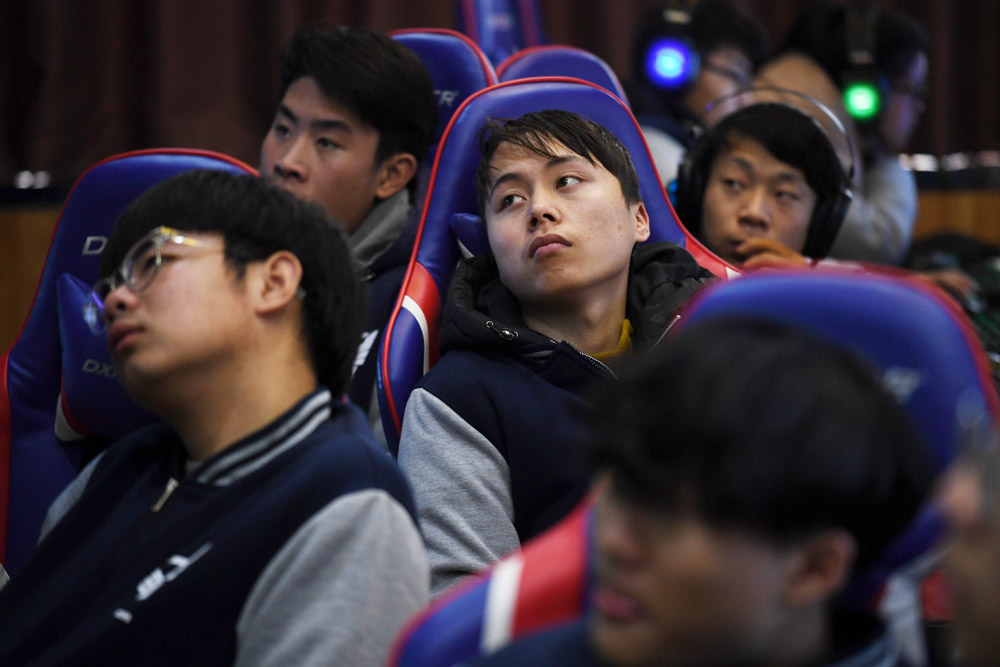 Students listen to a teacher explain gaming techniques in an esports class at the Lanxiang Technical School in Jinan, Shandong province, 2018. Greg Baker/AFP via People Visual