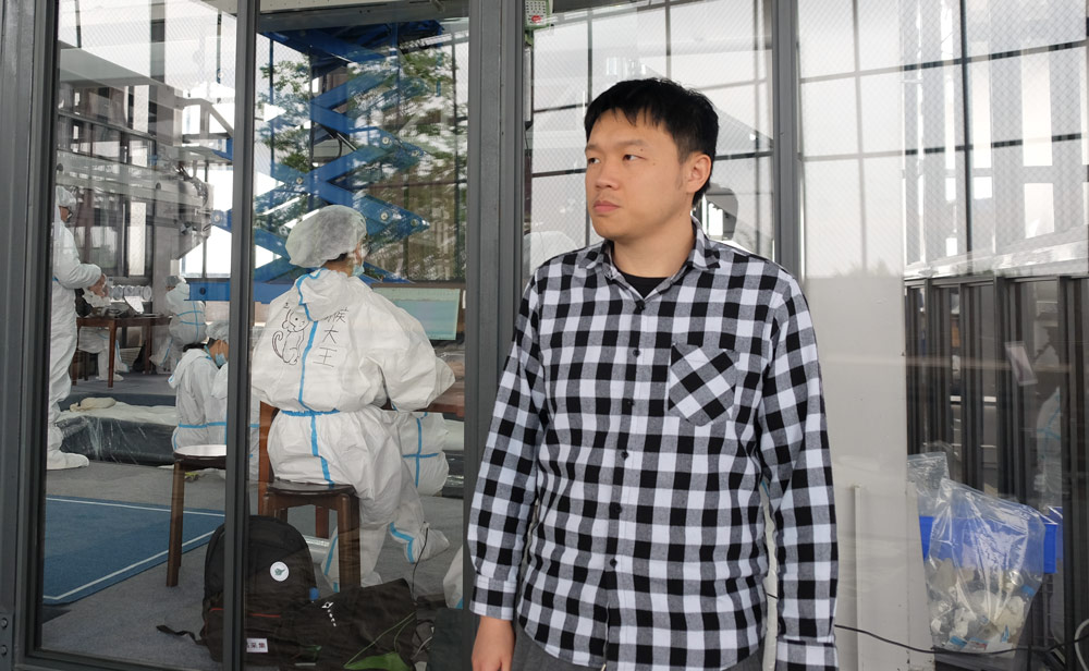 Xu Feihong stands outside the dig site in Sanxingdui, Sichuan province, April 2021. Ye Ruolin/Sixth Tone