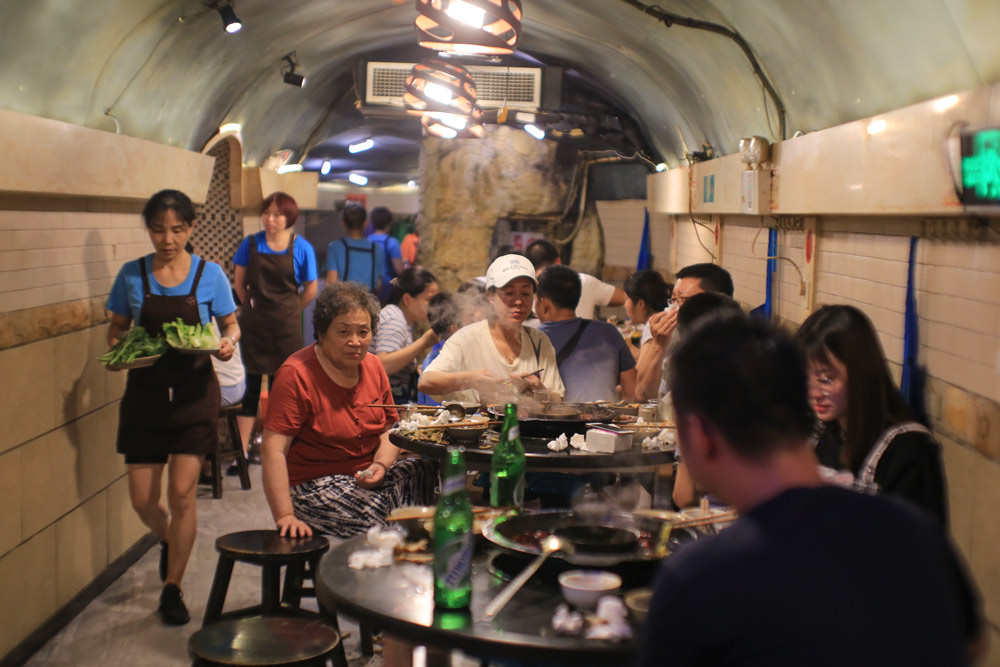 Diners enjoy a meal of hotpot at a restaurant in Chongqing, 2019. Su Zhigang/People Visual