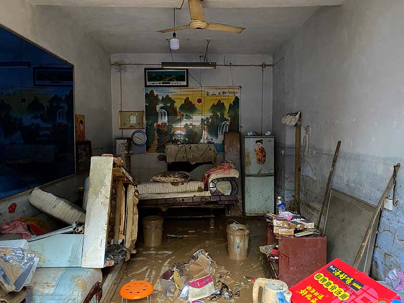 An interior view of a flooded house in Mihe Town, July 24, 2021. Xiao Yang for Sixth Tone