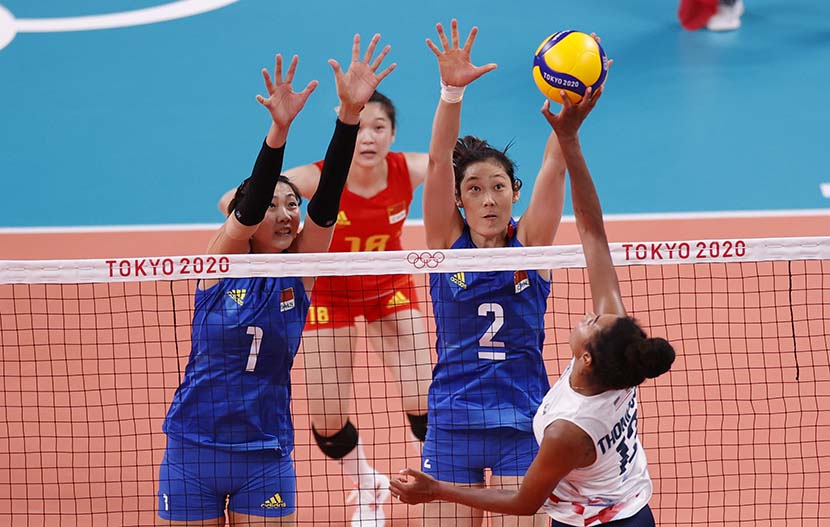 Zhu Ting of China (second from right) tries to stop the ball in the women's volleyball preliminary round pool B match against the United States during the Volleyball events of the Tokyo 2020 Olympic Games at the Ariake Arena in Tokyo, Japan, 27 July 27, 2021. People Visual