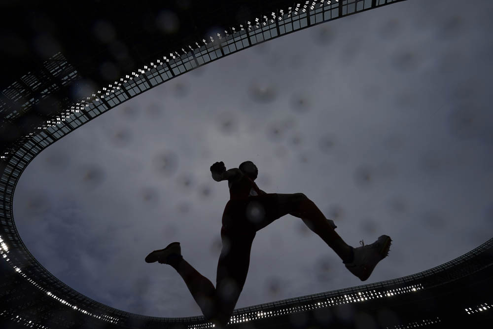 Zhu Yaming competes in the men’s triple jump event, Aug. 3, 2021. David J. Phillip/AP via People Visual