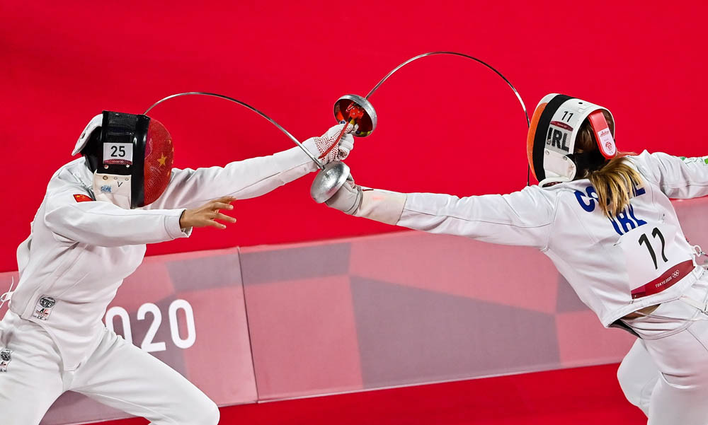 Zhang Xiaonan of China (left) in action against Natalya Coyle of Ireland in the women’s individual fencing event, Aug. 5, 2021. Brendan Moran/Sportsfile via People Visual