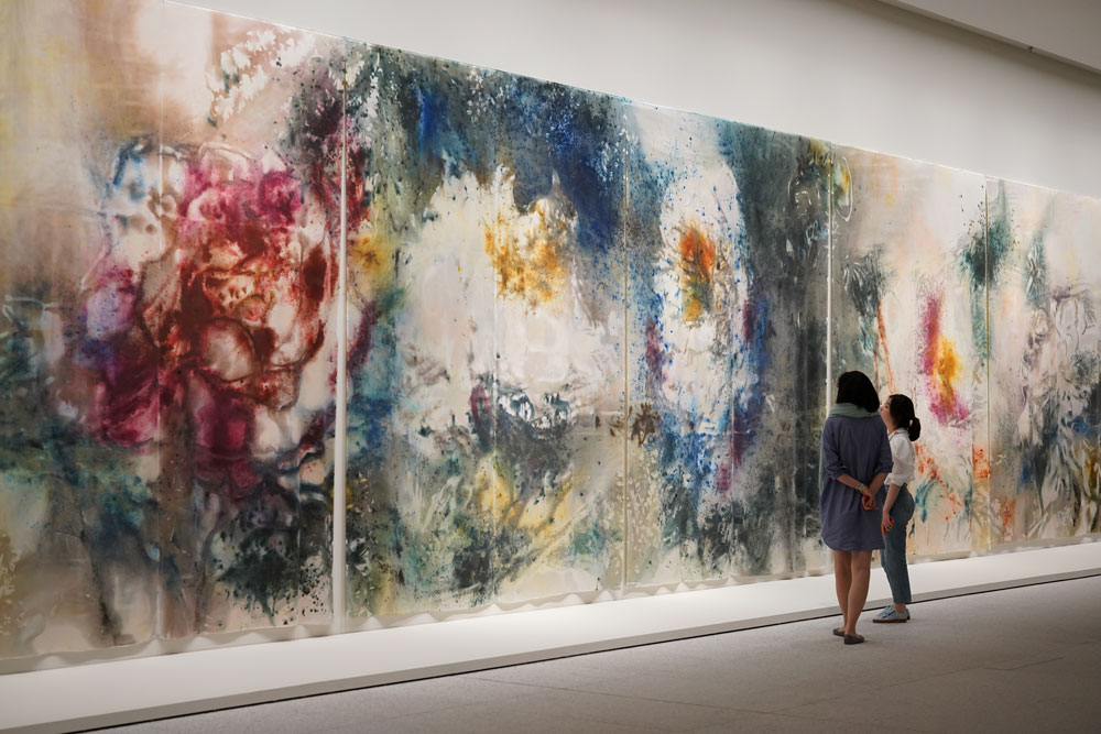 Visitors look at Cai’s “Transience II (Peony)” at the Museum of Art Pudong, 2021. Courtesy of Cai Studio, photo taken by Mengjia Zhao