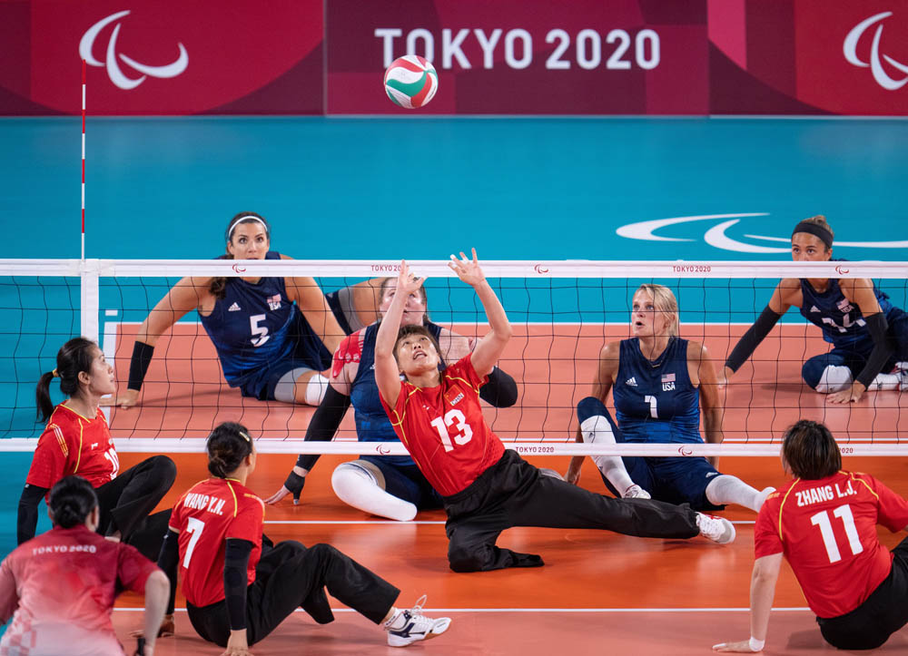Zhao Meiling (No. 13) sets the ball during the women’s sitting volleyball gold medal match in Tokyo, Japan, Sept. 5, 2021. Thomas Lovelock for OIS via IC