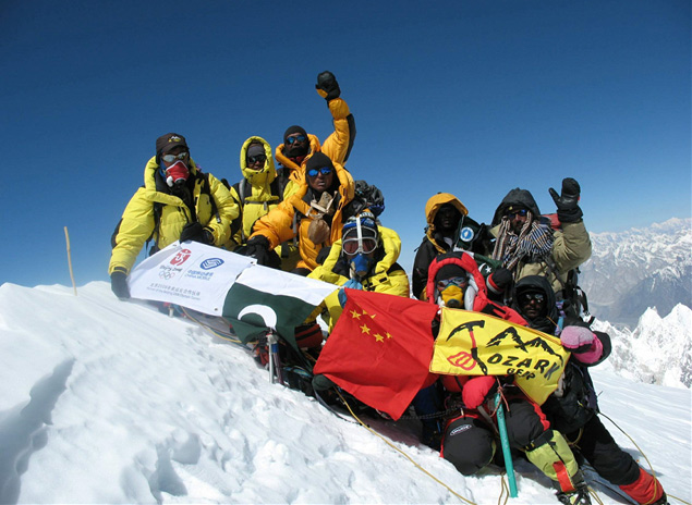 Luo Ze and other members of the China Tibet Mountaineering Team pose for a photo on Mt. Gasherbrum I, the 11th highest mountain in the world, on July 12, 2007. From China Tibet Mountaineering Association