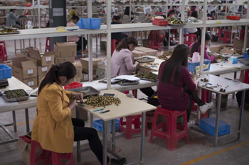 Women work at a workshop in Enshi, Hubei province, May 12, 2017. People Visual
