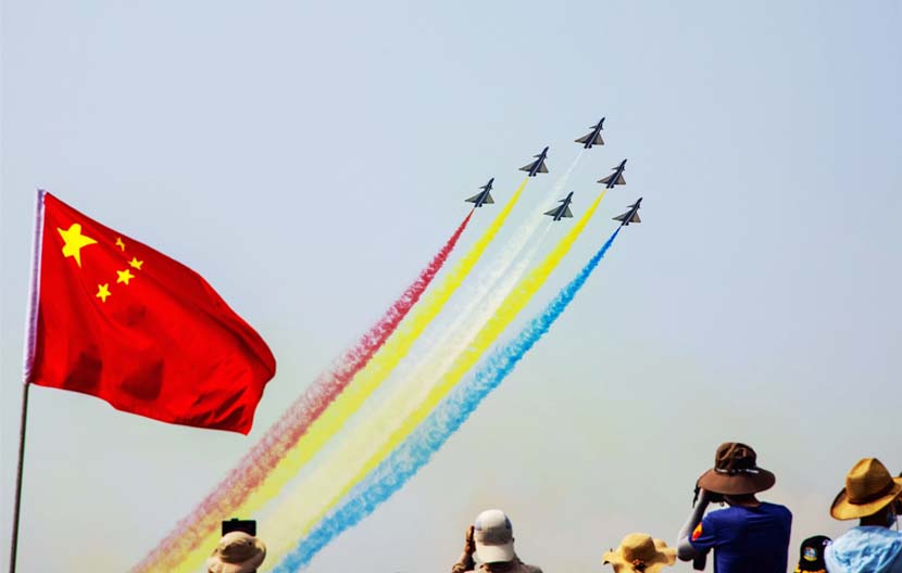 People capture the airshow at the 13th China International Aviation & Aerospace Exhibition in Zhuhai, Guangdong province, Oct. 1, 2021. People Visual