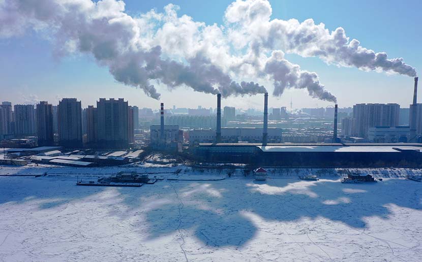 Several large chimneys run at full capacity to ensure heating in Harbin, Heilongjiang province, Feb. 8, 2021. People Visual