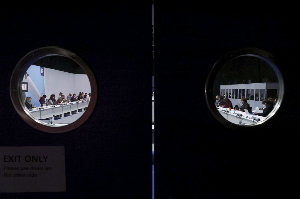 Delegates attend COP26 in Glasgow, Scotland, Nov. 11, 2021. Yves Herman/Reuters via IC