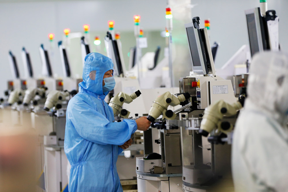 A worker at a chip fabricator in Suqian, Jiangsu province, July 2021. People Visual