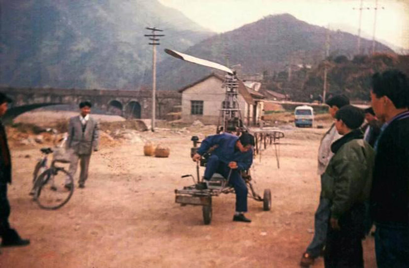 Xu Bin tests one of his early aircraft models in front of local villagers in the eastern Zhejiang province, 2000. Courtesy of Xu Bin