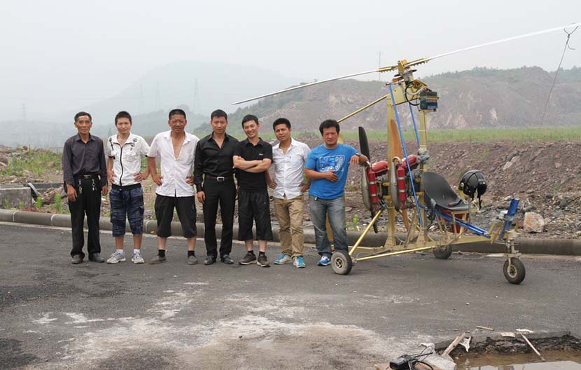 Xu Bin and other aviation enthusiasts pose for a photo after a test flight in Lishui, Zhejiang province, 2013. Courtesy of Xu Bin.