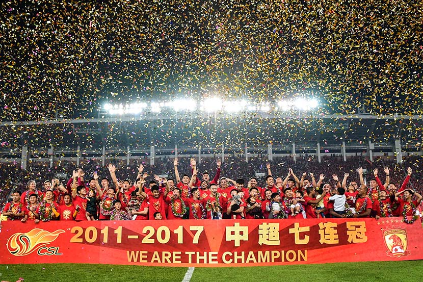 Guangzhou Evergrande players celebrate winning the 2017 Chinese Super League championship, in Guangzhou, Guangdong province, Oct. 22, 2017. IC