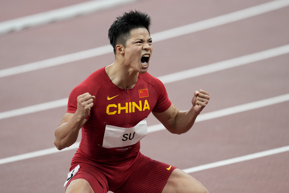 Sprinter Su Bingtian celebrates after winning a men’s 100-meter semi-final, Aug. 1, 2021. Richard Heathcote via People Visual