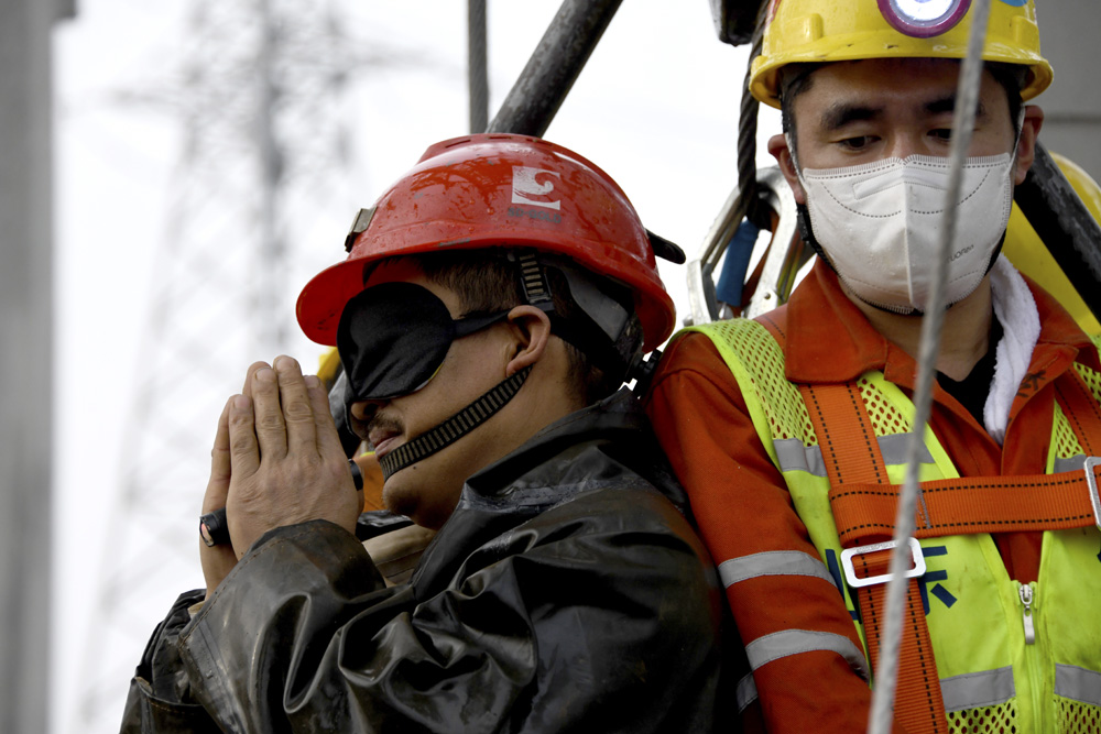 A miner is rescued after being trapped underground for two weeks following an explosion near Qixia, Shandong province, Jan. 24, 2021. Xinhua