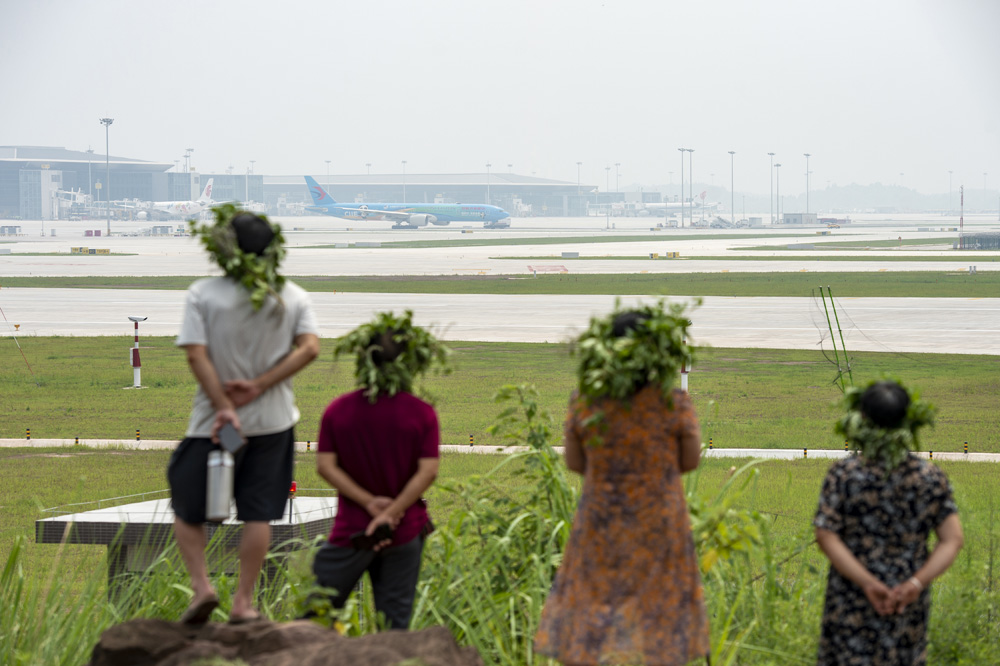 Residents watch a flight take off at Chengdu Tianfu International Airport in Chengdu, Sichuan province, June 27, 2021. Wang Qin/VCG