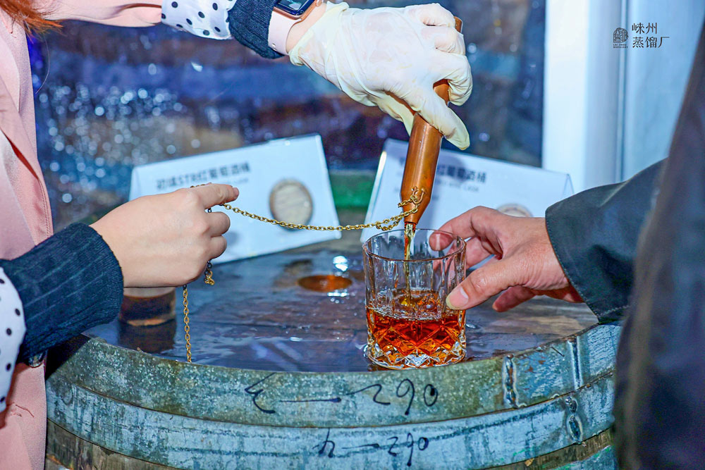 Visitors try Laizhou Distillery’s pilot test sample at an event, Oct. 19, 2021. Courtesy of Laizhou Distillery