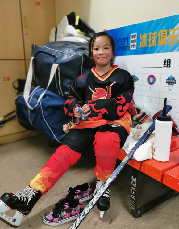 Huang Xinyi poses for a photo at an ice rink, in Kunming, Yunnan province, Jan. 23, 2022. Li Pasha for Sixth Tone