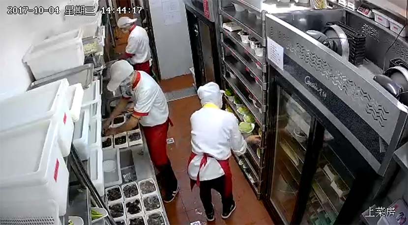 A screenshot from a livestream of a Haidilao kitchen in Beijing, Oct. 4, 2017. From the Sunshine Catering app