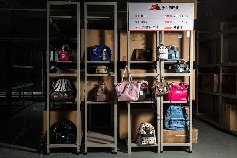 Handbags are displayed at a shelf inside the Alibaba’s counterfeits warehouse in Hangzhou, Zhejiang province, June 14, 2017. VCG