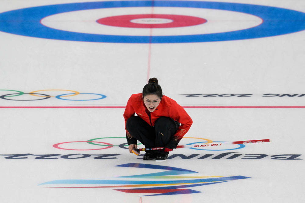 China’s Fan Suyuan during the mixed doubles round robin session 1 game of the curling competition against Switzerland, in Beijing, Feb. 2, 2022. Sebastien Bozon/AFP via VCG