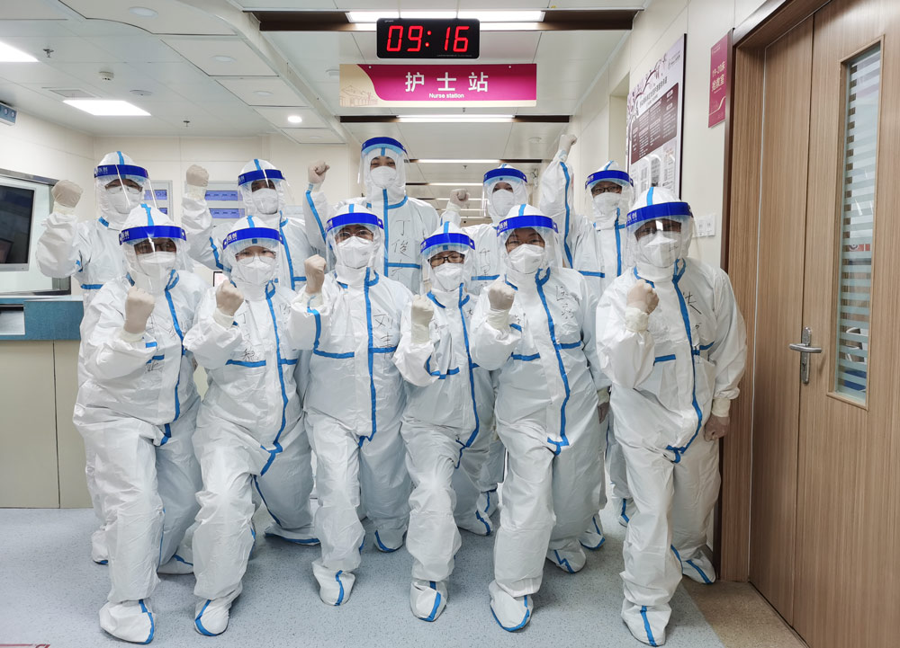 Liu Qing (front row, third from left) and her colleagues pose for a photo in Zhengzhou, Henan province, Sept. 1, 2021. Courtesy of Liu Qing