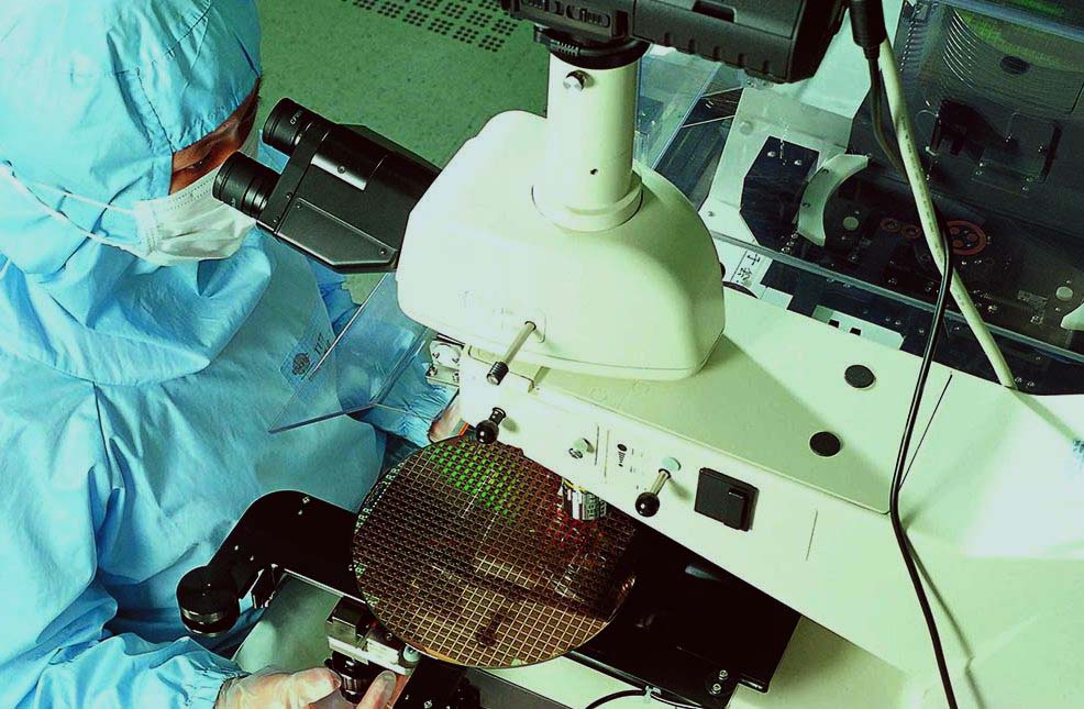 A man works at a TSMC 8-inch wafer fab. Courtesy of Taiwan Semiconductor Manufacturing Company, Limited.