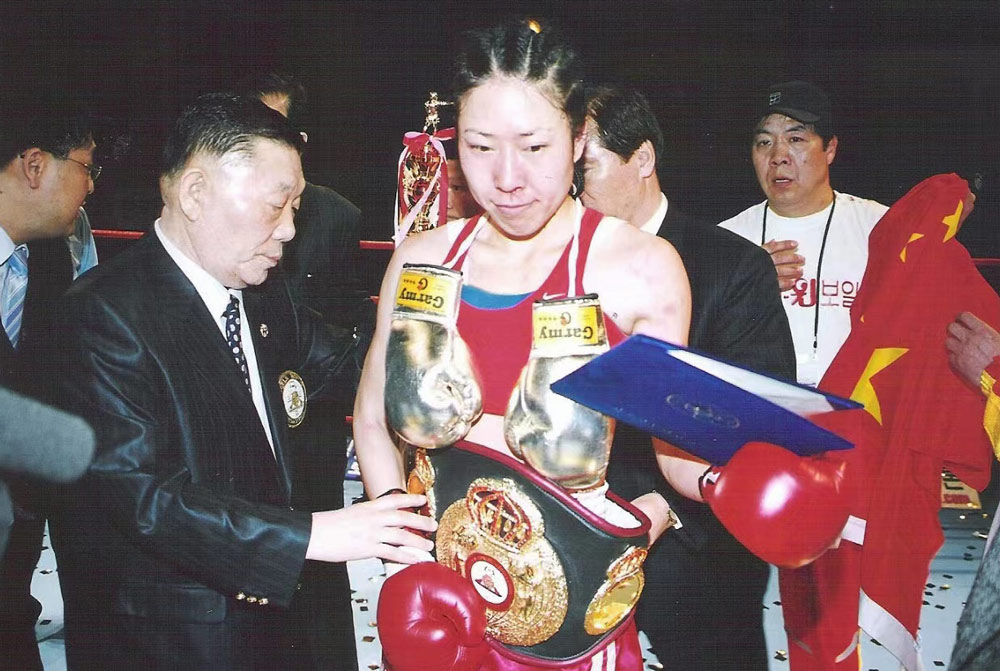 Gao Lijun becomes China’s first professional boxing champion after beating Kim Ha-na by technical knockout, 2006. Courtesy Gao Lijun