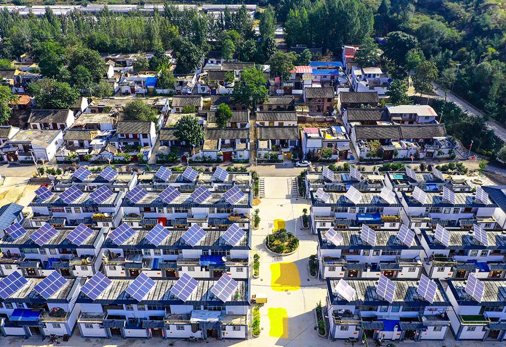 An aerial photo shows rooftop solar panels at a village in Sanmenxia, Henan province, Sept. 28, 2019. VCG
